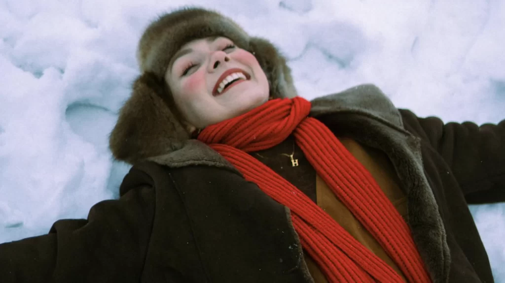 red scarf worn in the snow